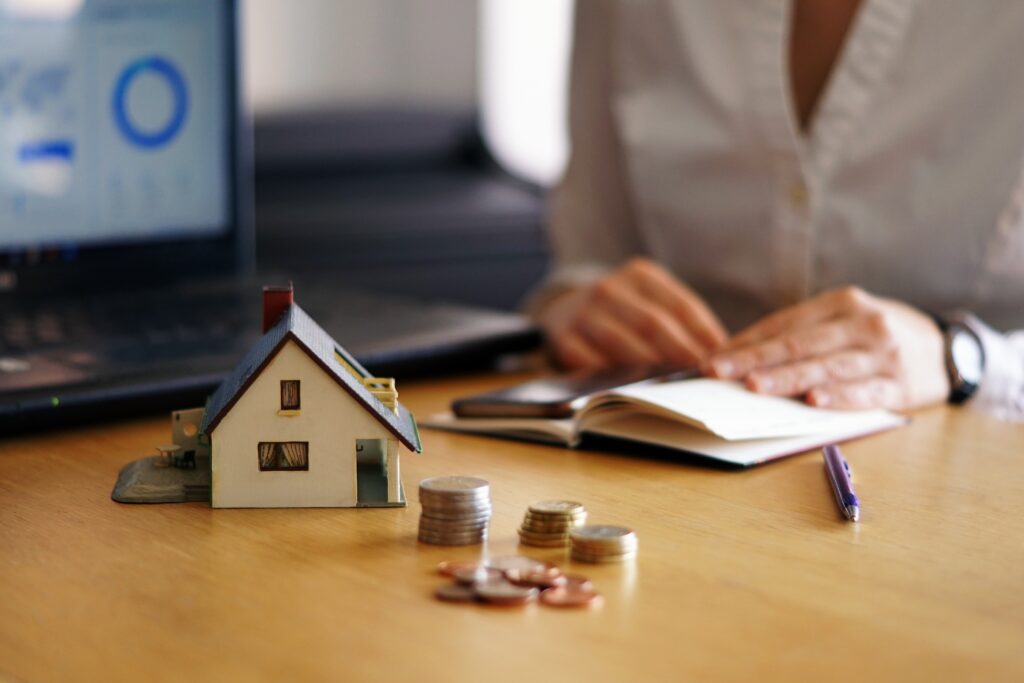 Closeup shot of a person thinking of buying or selling a house A closeup shot of a person thinking of buying or selling a house